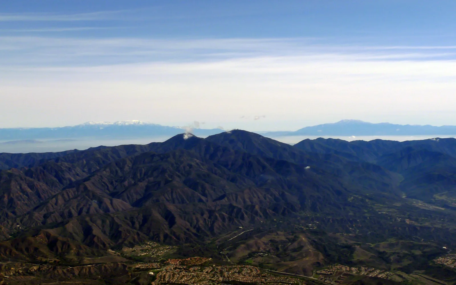 Distant view of the distinctive Saddleback landform formed by Santiago Peak and Modjeska Peak in the Santa Ana Mountains